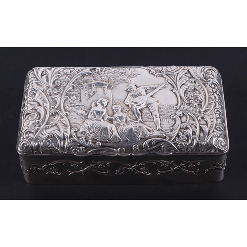 487 - An Edwardian silver dressing table box, decorated in relief with romantic figural scene, Birmingham ... 