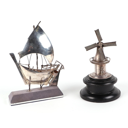 492 - A 925 silver model of a fishing boat, together with a Dutch white metal model of a windmill (2).