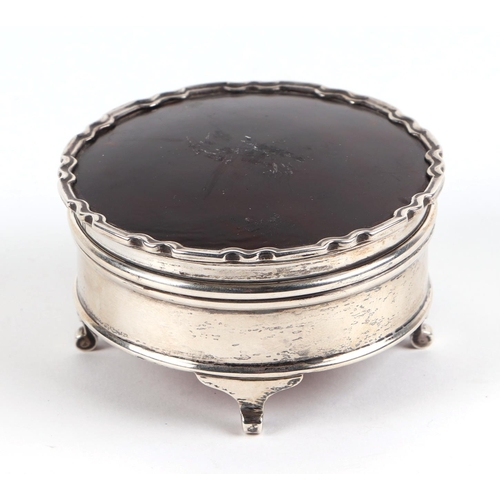 493 - A silver and tortoiseshell dressing table jewellery box, Birmingham 1921, 7.5cm diameter.