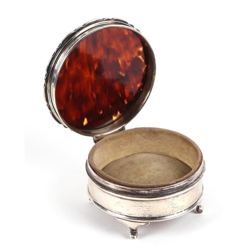 493 - A silver and tortoiseshell dressing table jewellery box, Birmingham 1921, 7.5cm diameter.