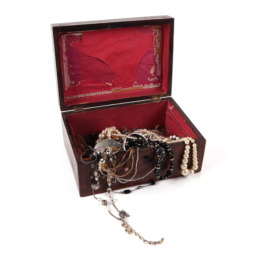 510 - A quantity of costume jewellery in a rosewood box.