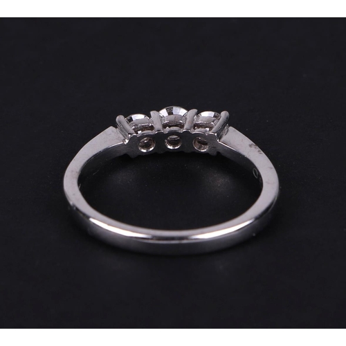 516 - A certificated 18ct white gold graduated three stone diamond ring, diamond approx 0.51ct, approx UK ... 