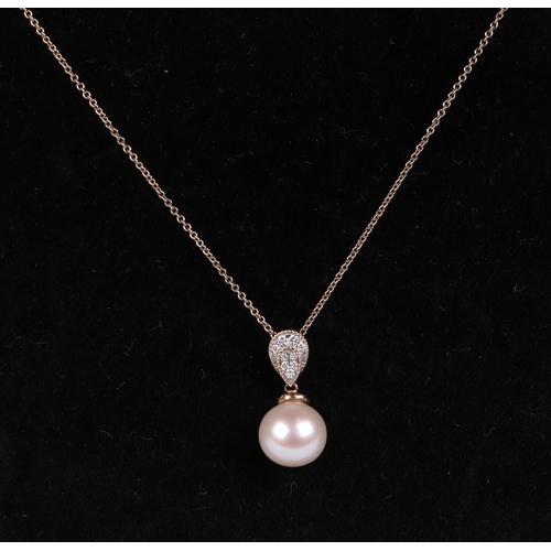 517 - A 9ct gold cultured pearl and diamond pendant, on a fine chain.