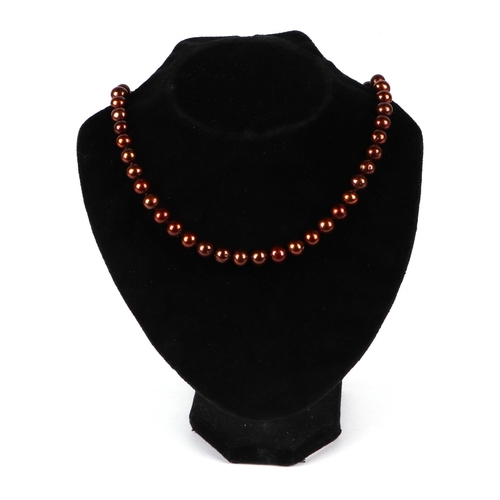 518 - A fresh water cultured chocolate pearl bead necklace, with 9ct gold coffee bean clasp, 45cm long.