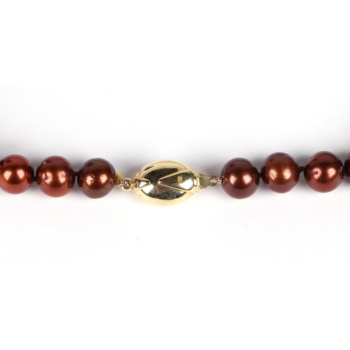 518 - A fresh water cultured chocolate pearl bead necklace, with 9ct gold coffee bean clasp, 45cm long.