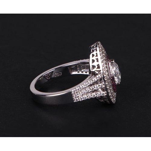 519 - An 18ct white gold ring set with a large pear-shaped rose cut diamond, within a calibre rubies and a... 