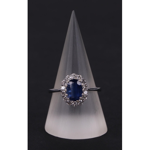 522 - A certificated 18ct white gold oval Kyanite and diamond cluster ring, Kyanite approx 1.77ct, approx ... 