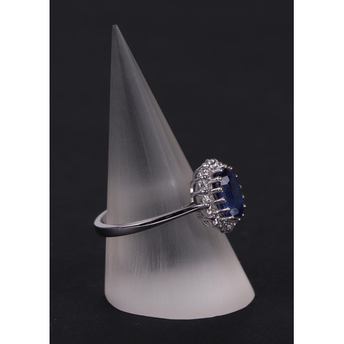 522 - A certificated 18ct white gold oval Kyanite and diamond cluster ring, Kyanite approx 1.77ct, approx ... 