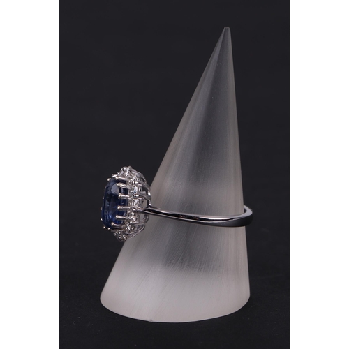 522 - A certificated 18ct white gold oval Kyanite and diamond cluster ring, Kyanite approx 1.77ct, approx ... 