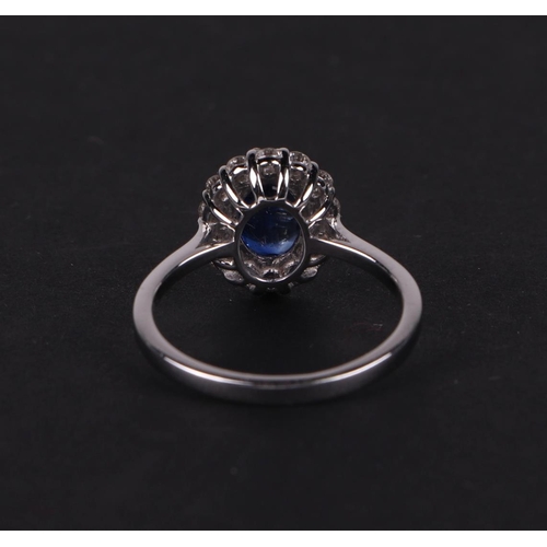 522 - A certificated 18ct white gold oval Kyanite and diamond cluster ring, Kyanite approx 1.77ct, approx ... 