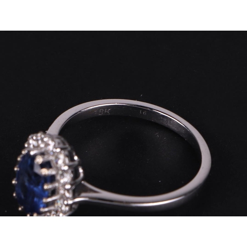 522 - A certificated 18ct white gold oval Kyanite and diamond cluster ring, Kyanite approx 1.77ct, approx ... 