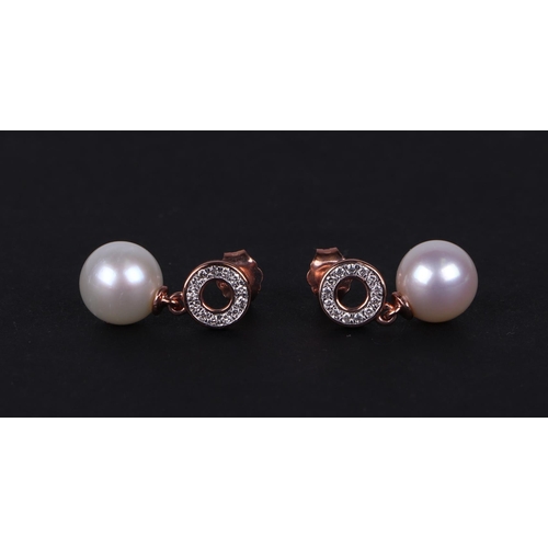 523 - A pair of 9ct rose gold pearl and diamond halo bail earrings.