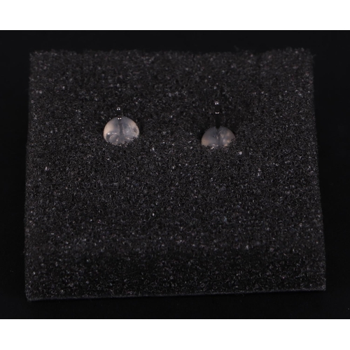 526 - A pair of platinum solitaire diamond stud earrings, diamonds approx 0.20ct.