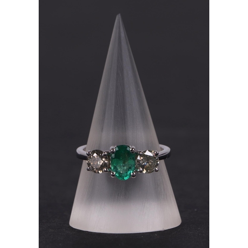 528 - A certificated 18ct white gold, emerald and diamond trilogy ring, emerald approx 0.66ct, diamond app... 