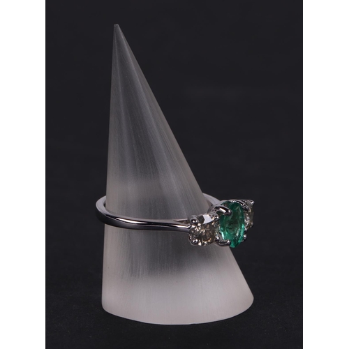 528 - A certificated 18ct white gold, emerald and diamond trilogy ring, emerald approx 0.66ct, diamond app... 