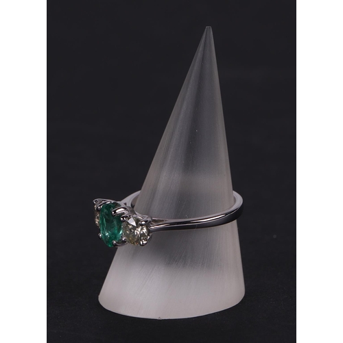 528 - A certificated 18ct white gold, emerald and diamond trilogy ring, emerald approx 0.66ct, diamond app... 