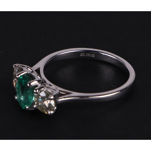 528 - A certificated 18ct white gold, emerald and diamond trilogy ring, emerald approx 0.66ct, diamond app... 