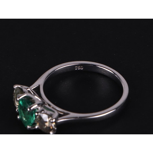 528 - A certificated 18ct white gold, emerald and diamond trilogy ring, emerald approx 0.66ct, diamond app... 