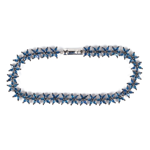 530 - A silver starfish bracelet set with 150 marquise cut blue cubic zirconia.