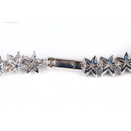 530 - A silver starfish bracelet set with 150 marquise cut blue cubic zirconia.