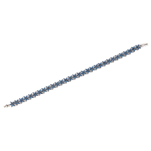 530 - A silver starfish bracelet set with 150 marquise cut blue cubic zirconia.