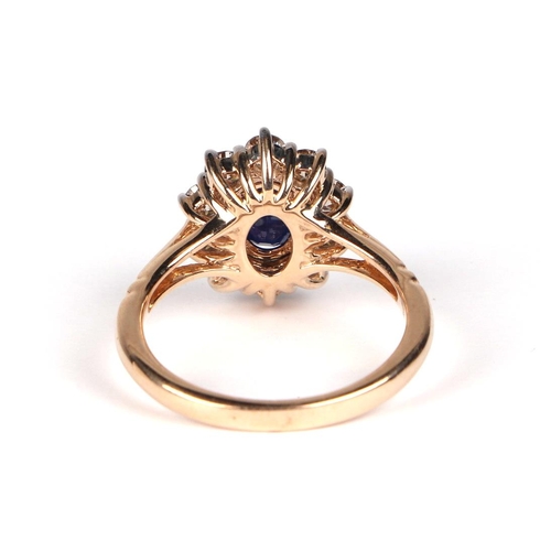 531 - A 9ct gold diamond and sapphire cluster ring, sapphire approx 1.00ct, approx UK size N