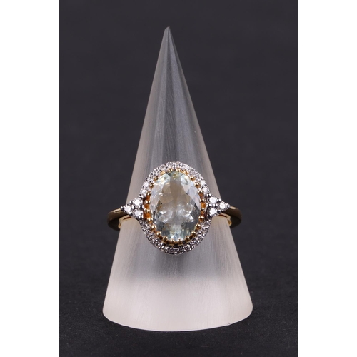 537 - A 14ct gold oval aquamarine and diamond cluster ring, aquamarine approx 2.01ct, approx UK size O.