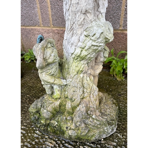 6 - A well weathered stoneware bird bath, 61cm high.