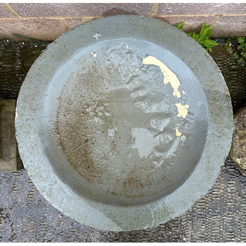 6 - A well weathered stoneware bird bath, 61cm high.