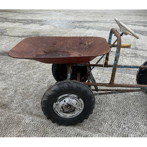 61 - A Tri-ang dumper truck, peddle car, for restoration.