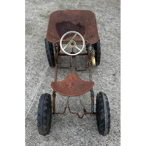 61 - A Tri-ang dumper truck, peddle car, for restoration.