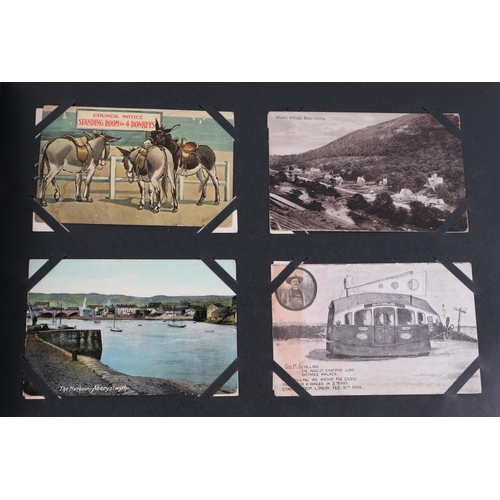 69 - A large postcard album covering the period from Victorian to the 1950s, including topographical, por... 