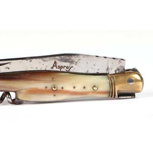 79 - A Laguiole type pocket knife with 9cm blade, corkscrew, pick and horn handle, the blade signed 