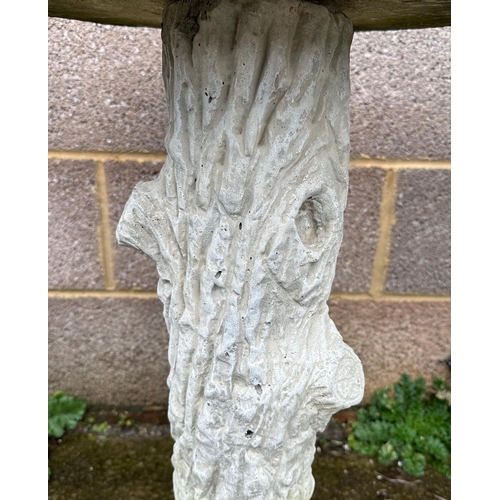 8 - A well weathered stoneware bird bath, 70cm high.