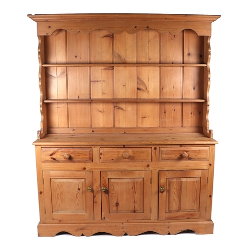 813 - A modern pine dresser, the two-tier plate rack with tongue & groove panelled back above a base of th... 