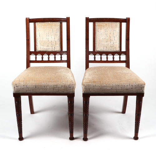 818 - A harlequin set of six Edwardian walnut dining chairs, with upholstered back and seats, on turned fr... 