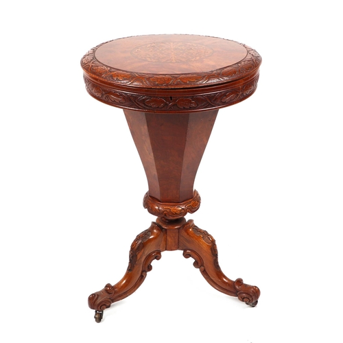 819 - A 19th century walnut trumpet work table, the circular top with carved and inlaid decoration, on a c... 