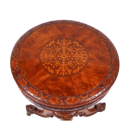 819 - A 19th century walnut trumpet work table, the circular top with carved and inlaid decoration, on a c... 