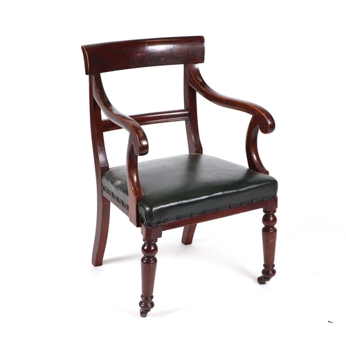 824 - A 19th century mahogany desk chair with upholstered seat, on turned front supports terminating in br... 