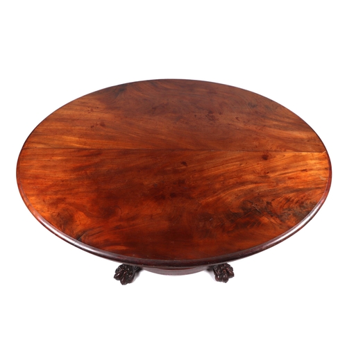 830 - A Victorian mahogany Loo table, the oval top on a turned column terminating in a platform with lion ... 