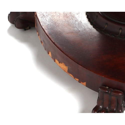 830 - A Victorian mahogany Loo table, the oval top on a turned column terminating in a platform with lion ... 