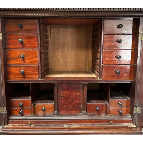 836 - A 19th century mahogany cabinet on stand, the cabinet having twin field panelled doors, opening to r... 