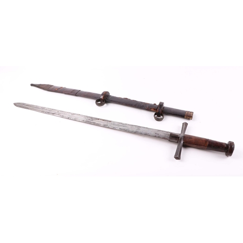 87 - A Sudanese Saharan kaskar sword, in leather scabbard, the fullered steel blade, with fine etched dec... 