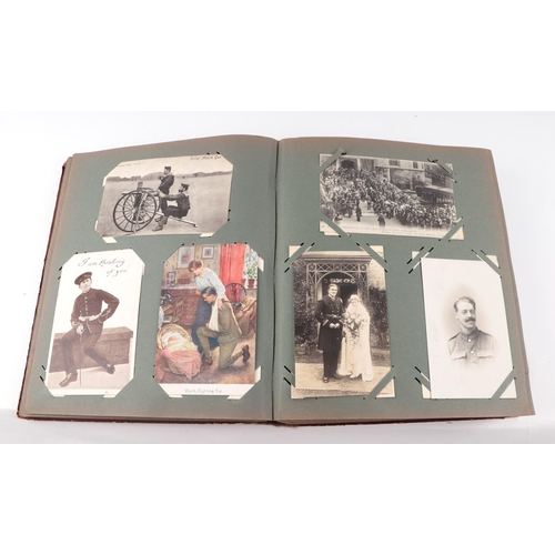 88 - A military interest postcard album, containing numerous late Victorian and WWI and later postcards, ... 