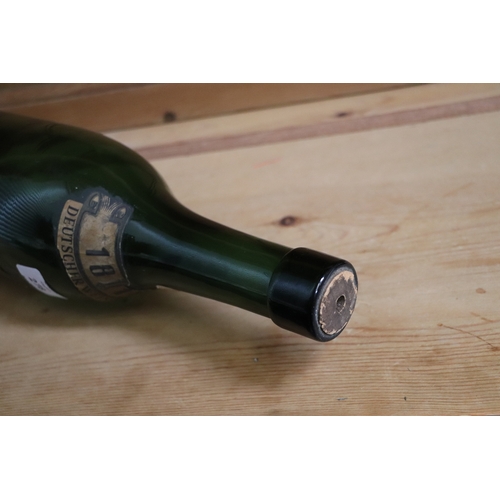 278 - A large hand blown green glass German wine bottle, 51cm high.