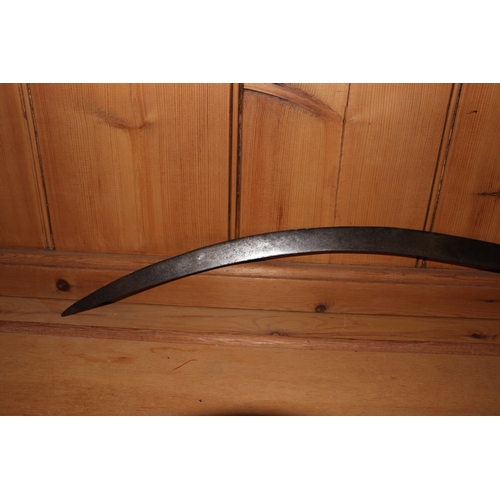 86 - An Indian tulwar sword, with curved steel blade and brass handle, 82cm long.