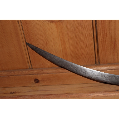 86 - An Indian tulwar sword, with curved steel blade and brass handle, 82cm long.