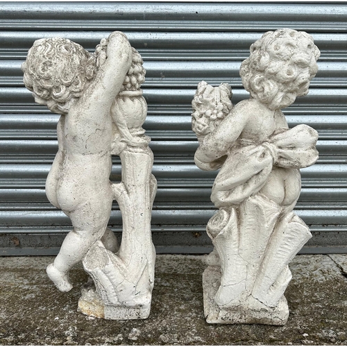 11 - A pair of 19th century composition Coade style  stone putti, in well weathered condition, each appro... 