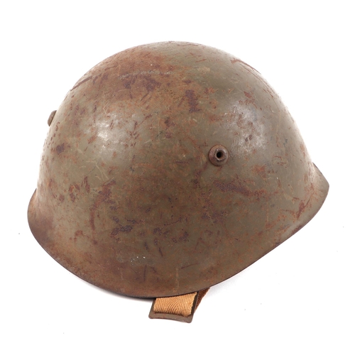 119 - A WWII Italian army M33 steel combat helmet, with leather liner and chin strap.