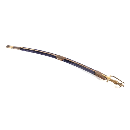 125 - An Indian shamshir type modern sword, with engraved steel blade, brass hilt and velvet covered scabb... 